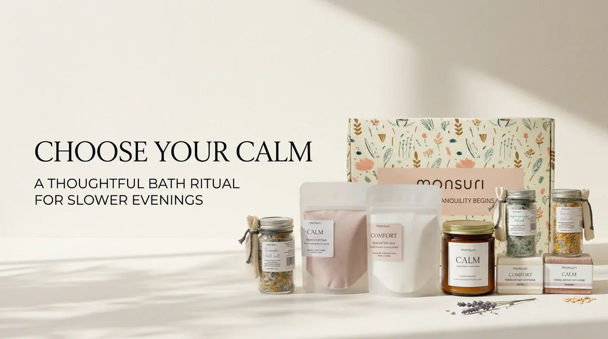 Choose Your Calm: the Monsuri bath gift set on a sunlit surface beside its botanical gift box, a thoughtful bath ritual for slower evenings.