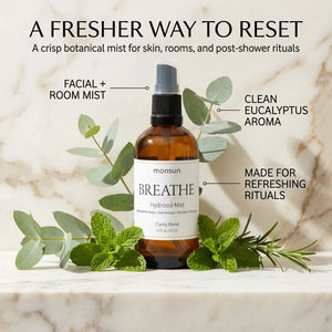 Monsuri BREATHE eucalyptus hydrosol surrounded by fresh eucalyptus, mint, and rosemary, labeled facial and room mist, clean eucalyptus aroma, made for refreshing rituals.