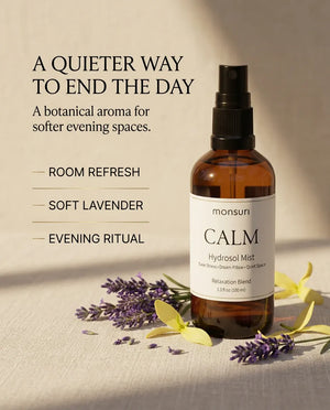 Monsuri CALM lavender hydrosol in soft evening light with lavender sprigs, captioned a quieter way to end the day: room refresh, soft lavender, evening ritual.