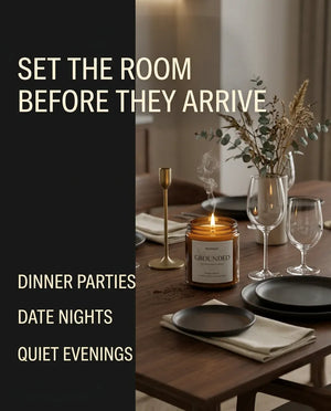 Monsuri GROUNDED candle graphic 'Set the Room Before They Arrive' showing the candle lit on a set dinner table with eucalyptus and wine glasses
