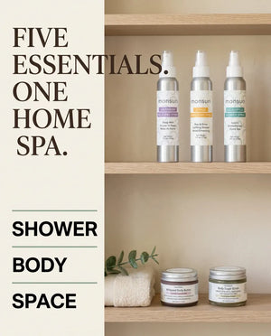 Monsuri Sensory Symphony gift set styled on wood shelves, labeled five essentials, one home spa: shower, body, space.