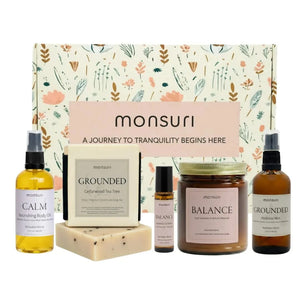 Stress relief gift set with palo santo candle, cedarwood tea tree soap bar, relaxation body oil, meditation mist and essential oil roller in botanical gift box