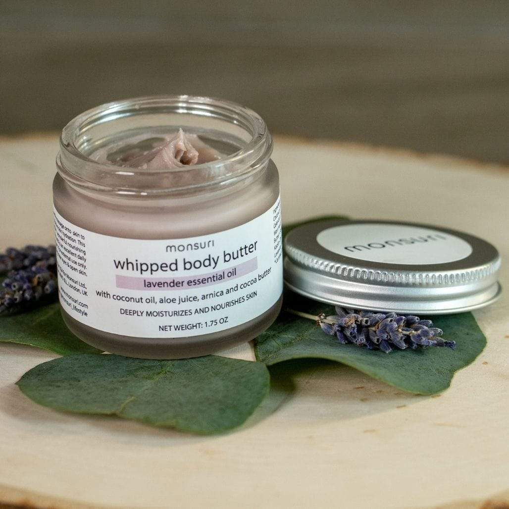 Monsuri's Lavender Body Butter in elegant packaging placed on a wooden surface.