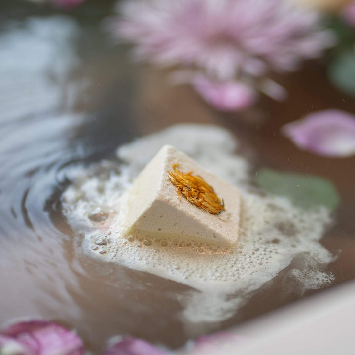 Close-up of Monsuri's Lemongrass Bath Bomb revealing bright, natural ingredients.