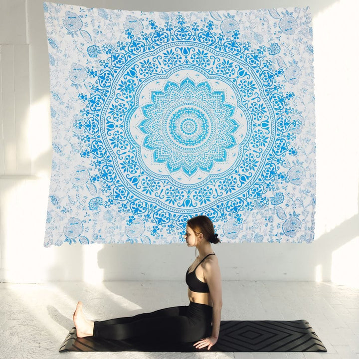 Blue and turquoise mandala tapestry hung as a wall hanging