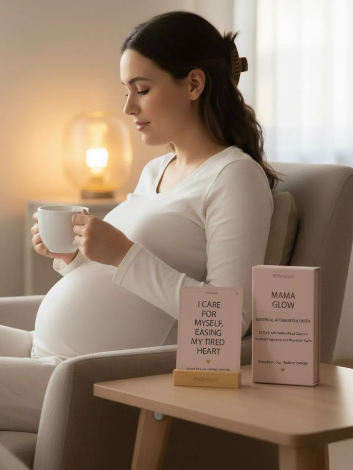 Pregnant woman reading new mom affirmation cards during third trimester - pregnancy anxiety relief and birth preparation affirmation practice