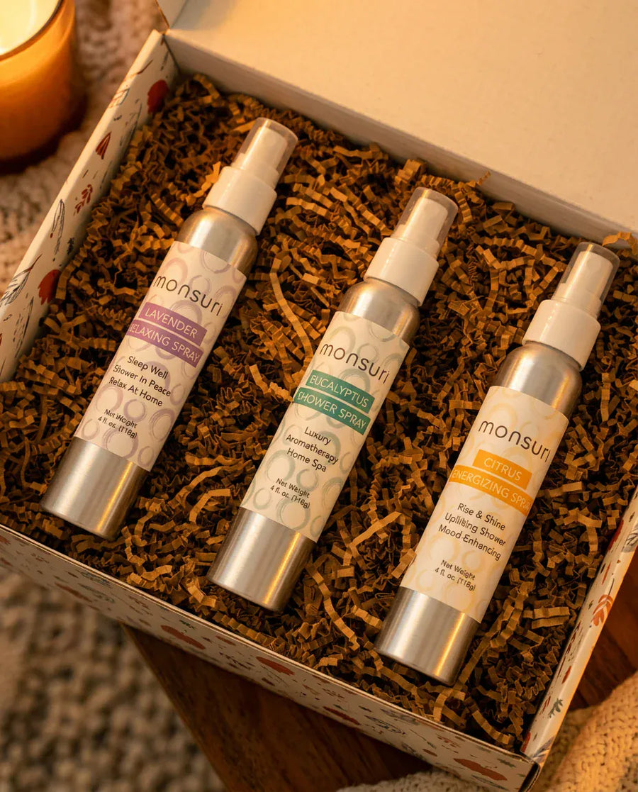 The botanical kraft gift box as it ships — kraft shred, a eucalyptus sprig, the note inside.