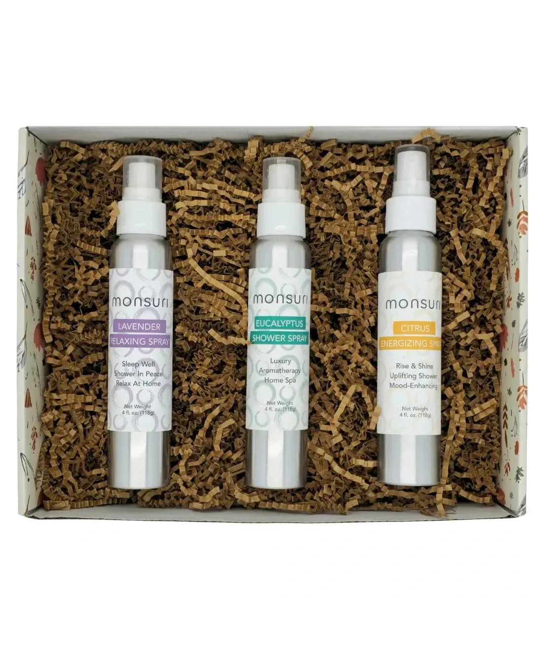 The Monsuri aromatherapy shower spray gift set open in its kraft gift box on shredded kraft fill - the 4 oz LAVENDER relaxing spray, EUCALYPTUS shower spray and CITRUS energizing spray, ready to give