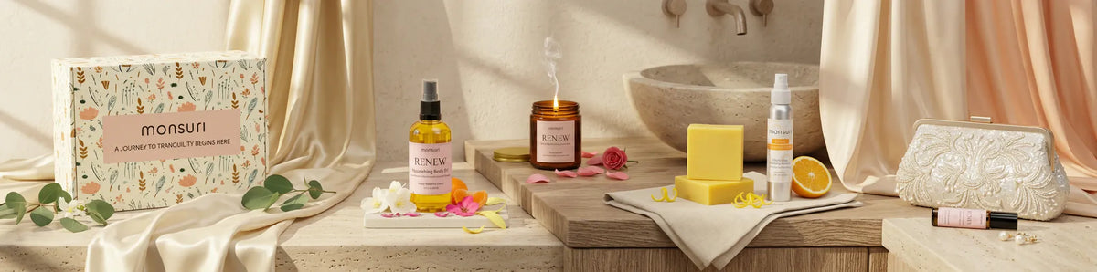 The Bridesmaid Bliss gift set laid out across a bridal suite vanity with a beaded clutch, eucalyptus and draped silk - botanical gift box, body oil, candle, lemon zest soap, citrus spray and essential oil roller