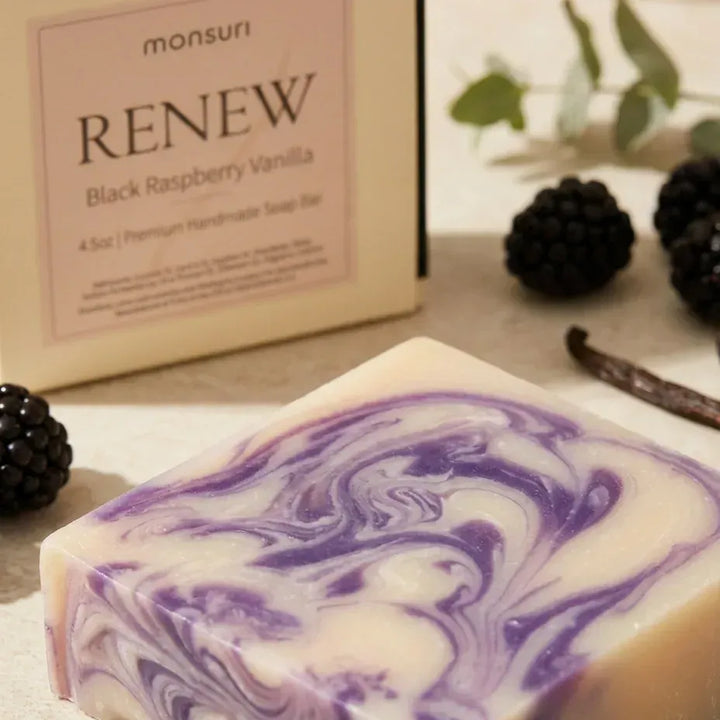 Close-up of the Black Raspberry Vanilla soap bar swirl with blackberries and vanilla pods — natural handmade soap bar