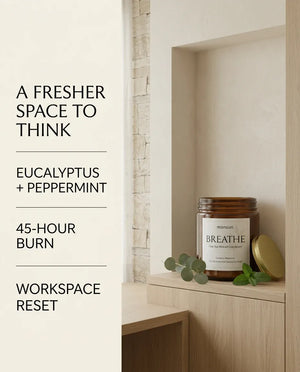 Infographic listing Monsuri BREATHE candle facts: eucalyptus and peppermint scent, 45-hour burn time, and workspace reset, beside the jar on a wood shelf.