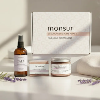 Lavender sleep gift set with pillow spray bath bomb body butter self care evening wind down in botanical gift box.
