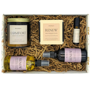 Care package for women in Monsuri botanical gift box with kraft shred, showing thinking of you gifts for women beautifully presented