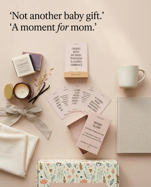Not another baby gift - a moment for mom, with the Mama Glow cards, the COMFORT candle and soap laid out on linen
