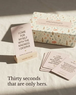 Thirty seconds that are only hers - a Mama Glow card reading I CARE FOR MYSELF WITH THE KINDNESS I DESERVE beside the deck and the gift box