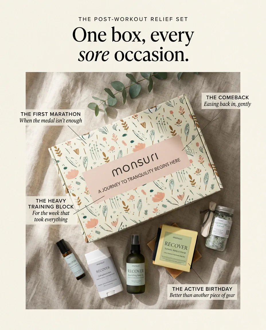 One box, every sore occasion — the botanical kraft gift box and the five recovery pieces on rumpled linen, labelled for the first marathon, the comeback, the heavy training block and the active birthday.