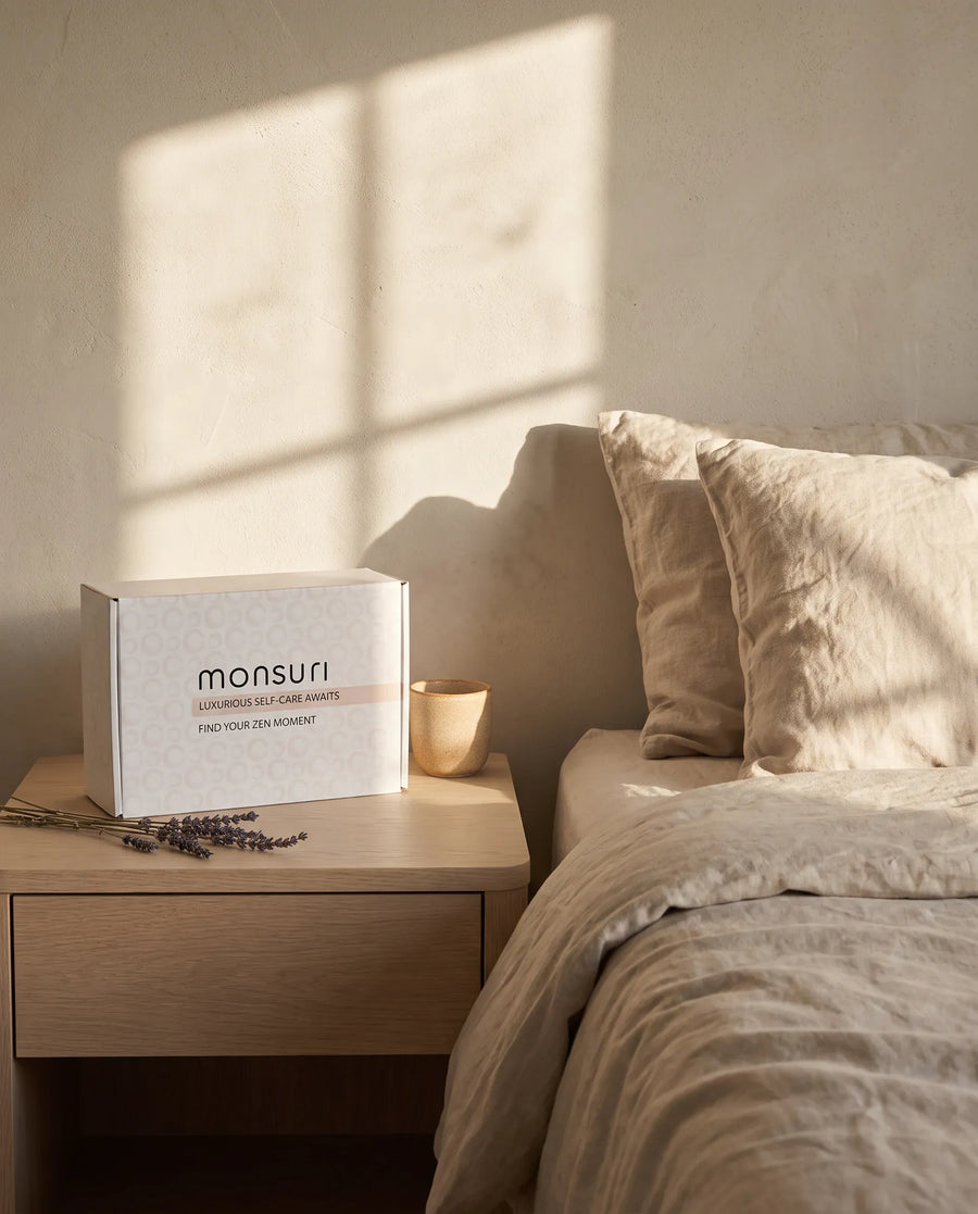 The botanical kraft gift box as it ships — kraft shred, a eucalyptus sprig, the note inside.
