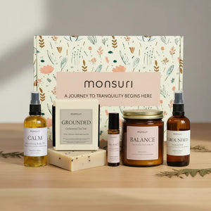 Stress relief gift set with palo santo candle, cedarwood tea tree soap bar, relaxation body oil, meditation mist and essential oil roller in botanical gift box