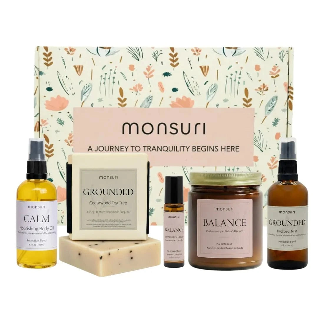 Stress relief gift set with palo santo candle, cedarwood tea tree soap bar, relaxation body oil, meditation mist and essential oil roller in botanical gift box