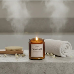 Comfort scented candle with steam rising in spa bathroom scene for soothing self care and relaxation