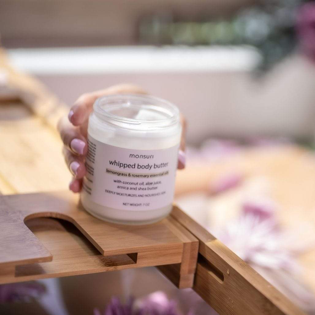 Open jar of Monsuri's Body Butter with Lemongrass and Rosemary essence.