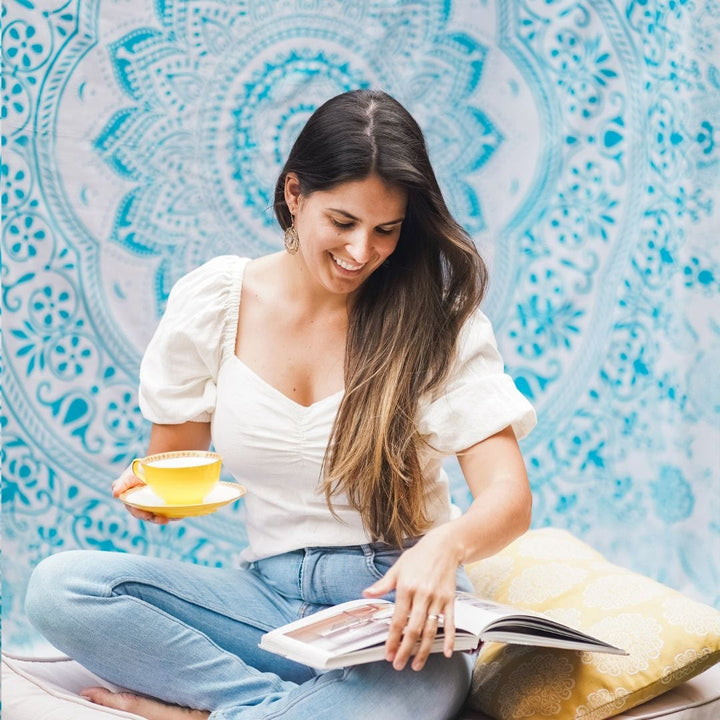Blue mandala tapestry folded to show the full design