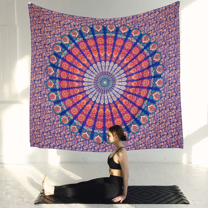 Close-up detail of the red and blue mandala tapestry's circular pattern