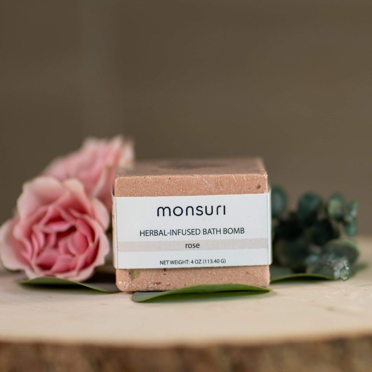 Artisan-crafted Monsuri Restorative Rose Bath Bomb showcasing natural ingredients.
